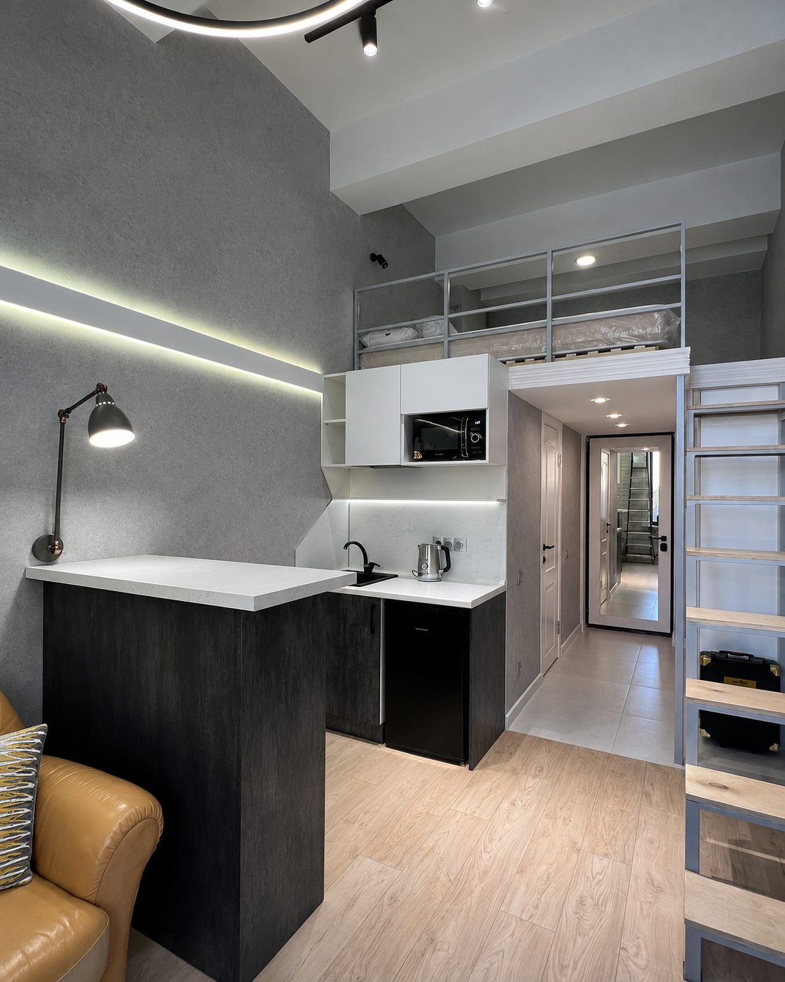 Кухня-гостиная после ремонта в компактной квартире 19 м² ЖК LOFT FM